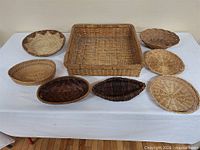 Eight baskets on table