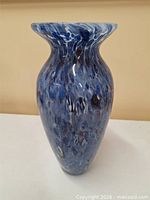 Full view of mottled blue hand-blown glass vase