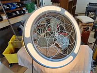 Front view showing LED ring and protective grille