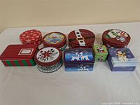 Group view of all ten Christmas tins