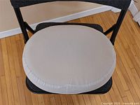 Top view of beige oval cushion on chair