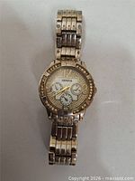 Front view of Geneva quartz wristwatch showing dial and rhinestone bezel