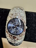 Front view showing dial, band design and rhinestones