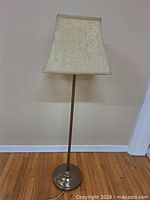 Full view of floor lamp with shade in place