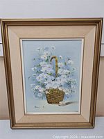 Full view of framed painting showing floral subject and signature
