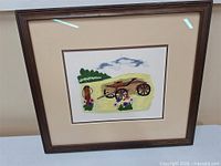Front view of framed embroidery artwork