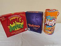 Front view of Apples to Apples, Taboo and Jenga boxes