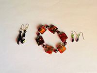 Overview of bracelet and both earring pairs