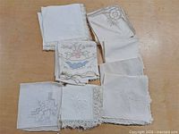 All hankies laid out showing variety of embroidery and lace