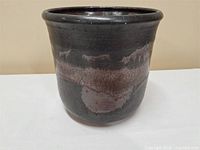 Full view of stoneware jardiniere showing shape and glaze