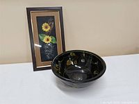 Overall view of bowl and framed artwork