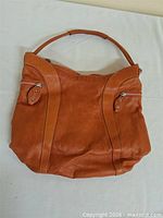 Full view front of leather handbag showing overall design