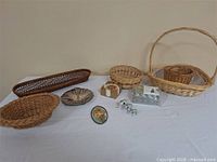 Group shot of all baskets, dish, plaque, elephants, coasters, tealights
