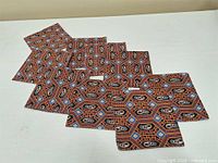 All nine napkins laid out showing full pattern