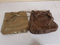 Both handbags side by side for overall view