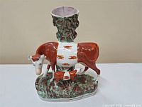 Full view of spill vase with cow and calf