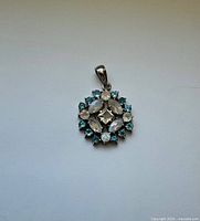 Front view of pendant showing gemstone arrangement