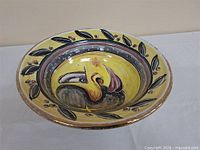 Oblique view showing interior artwork and rim decoration