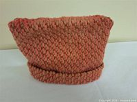 Front view of knit wool teapot cozy