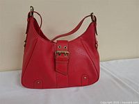 Full view of red Tommy Hilfiger shoulder handbag