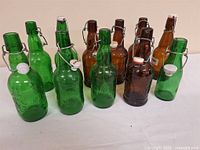 group of green and amber swing-top bottles