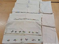 All pillowcases laid out showing varied embroidery designs
