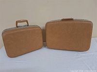Both suitcases closed showing exterior