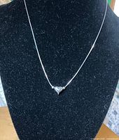 Full view of sterling necklace on display bust
