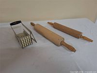 Full lot view showing both rolling pins and fry cutter