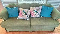 Front view of sofa with pillows on seat