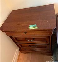 Full view of nightstand showing three drawers