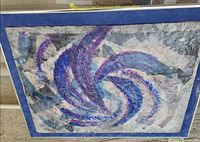 Front view of framed abstract textile art showing full design and frame