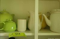 Shelf view showing green Adeline teapot, green sugar bowl, white Cromford pieces