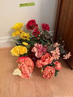 Group shot of all artificial flower arrangements on floor