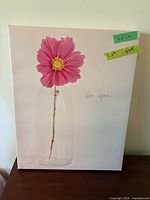 Front view of canvas showing pink flower, clear bottle, text "Be you"
