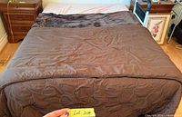 Overall view of bed, showing frame footprint and box spring