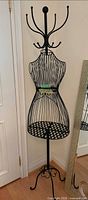Full view of black wire mannequin rack