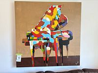 Front view of entire signed abstract piano canvas painting