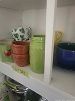 Group view showing apple mug, Fragolino cups, Authentic Mason jar mug, heart mug, yellow mug, blue bowl and saucer