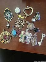 All pendants and charms laid out on table