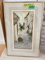 Full view of framed watercolor art showing frame and mat
