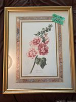 Full view of framed print showing pink hollyhock and gold frame