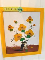 Full view of framed impasto floral painting in yellow frame