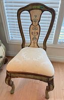 Full view of chair showing upholstery, frame, legs