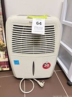 Front view showing Honeywell dehumidifier, grille, capacity badge, power cord