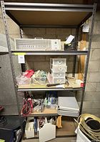 Front view of metal shelving unit with contents (not included)