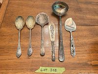 Six utensils laid out showing overall forms and condition