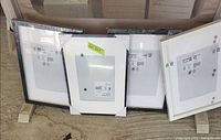 Front view of all four shrink-wrapped frames