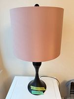Full view of one lamp showing shade and base