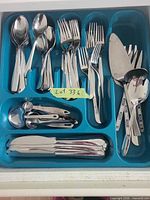 full contents in blue drawer organizer